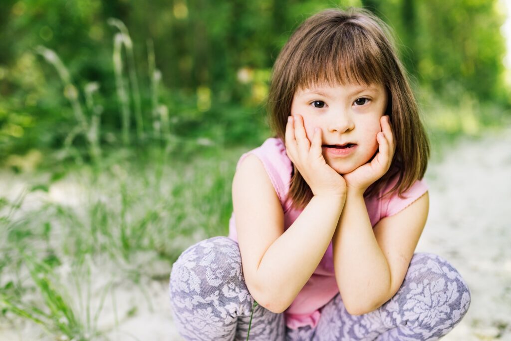 Portrait of young girl with down syndrome